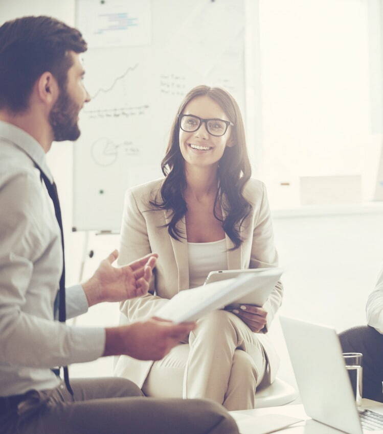 two Working Solutions Recruitment colleagues discussing a project